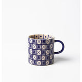 Jones & Co Caravan Espresso Indigo ceramic mug with detailed blue and white pattern, perfect for coffee or tea.