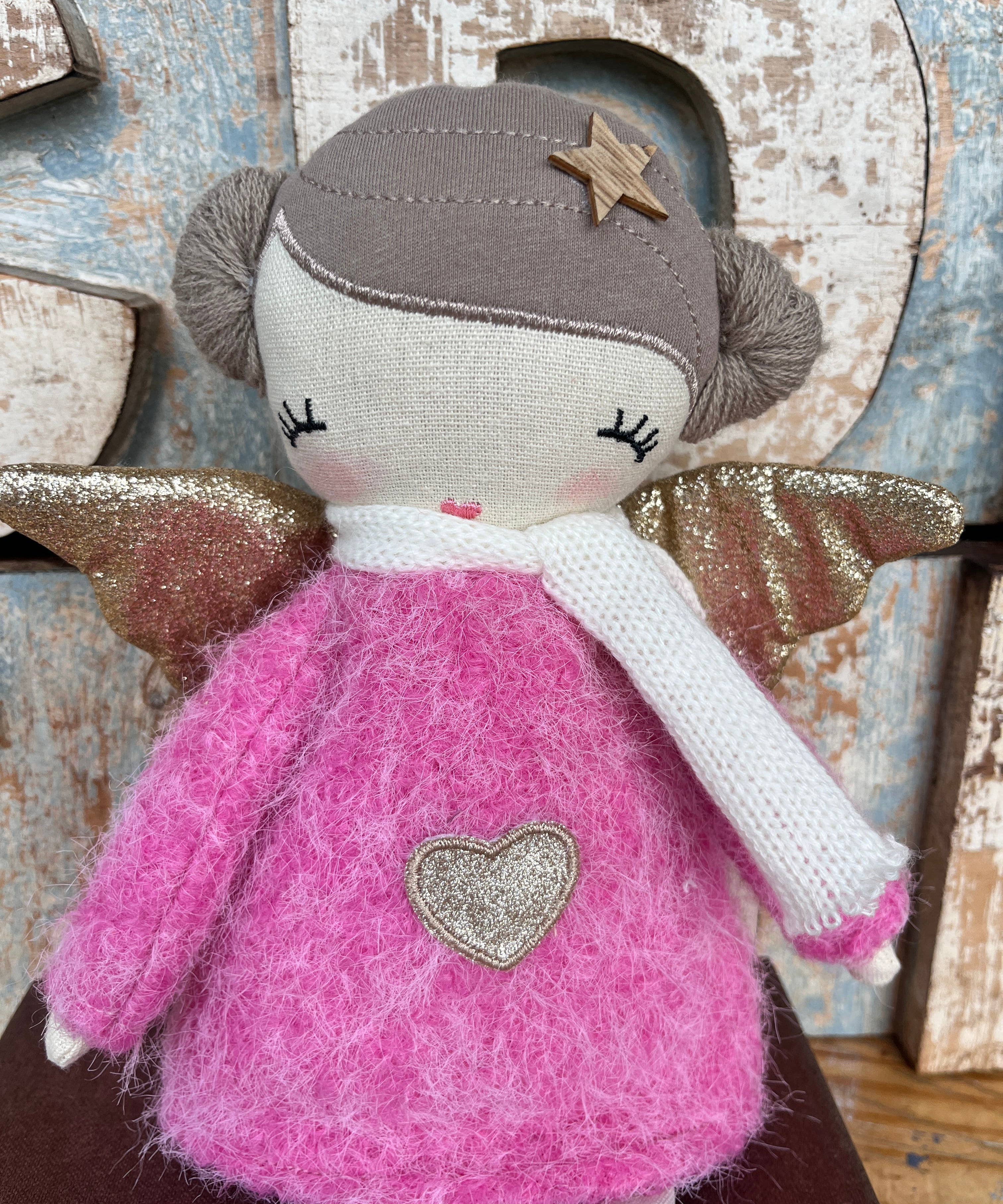 Amaranta Designs Bubblegum Doll with pink hair, colorful outfit, and playful pose on a plain background.
