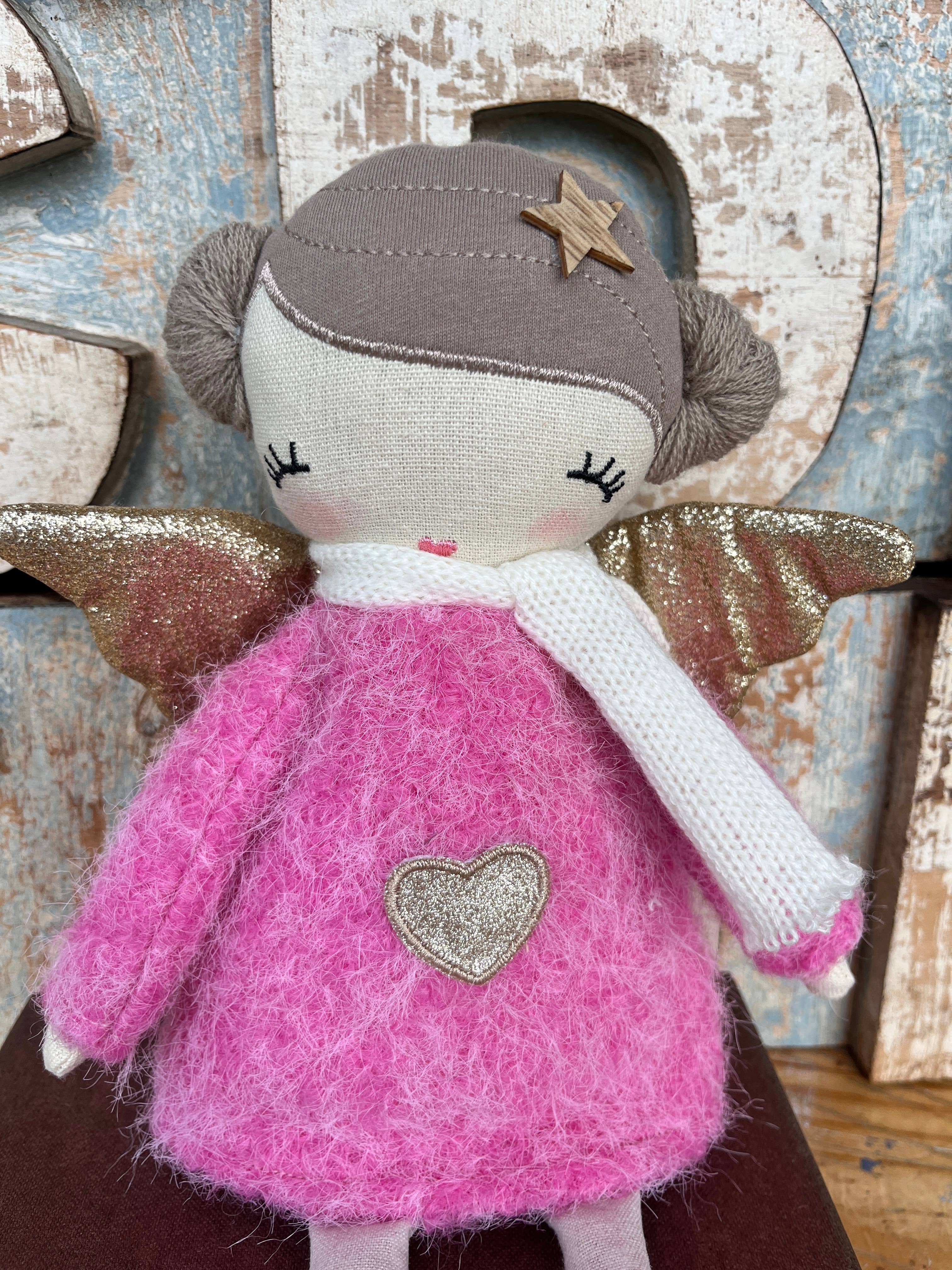 Amaranta Designs Bubblegum Doll with pink hair, colorful outfit, and playful pose on a plain background.