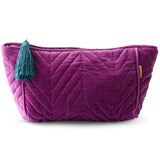 Kip & Co Wild Grape velvet toiletry bag with zipper closure, soft fabric, and compact design for accessories storage.