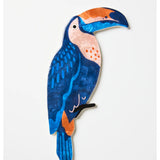 Jones & Co navy wall art featuring a colorful toucan perched on a branch, ideal for tropical or nature-inspired decor.