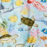 Kip & Co Reef Life bamboo swaddle with ocean-inspired reef print, soft and lightweight fabric for newborn comfort.