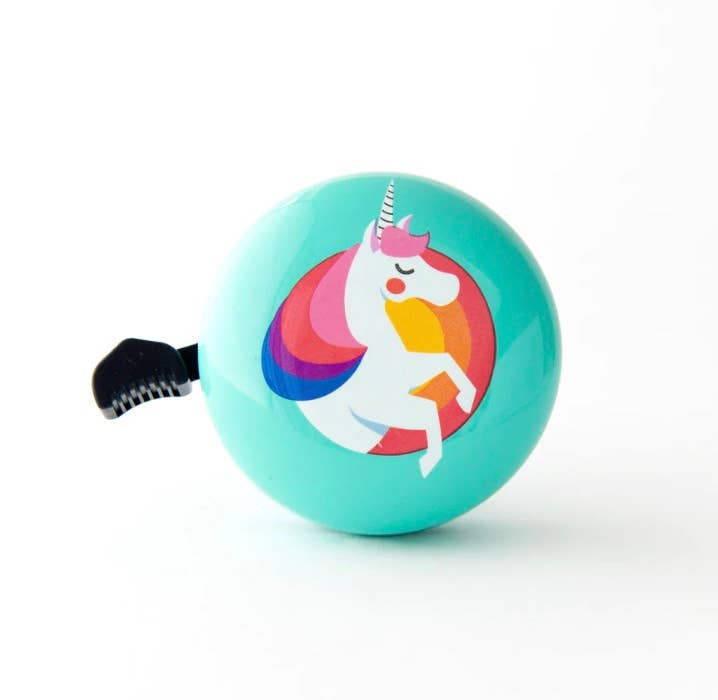 Beep unicorn bike and scooter bell in mint color with a playful unicorn design, mounted on a handlebar.