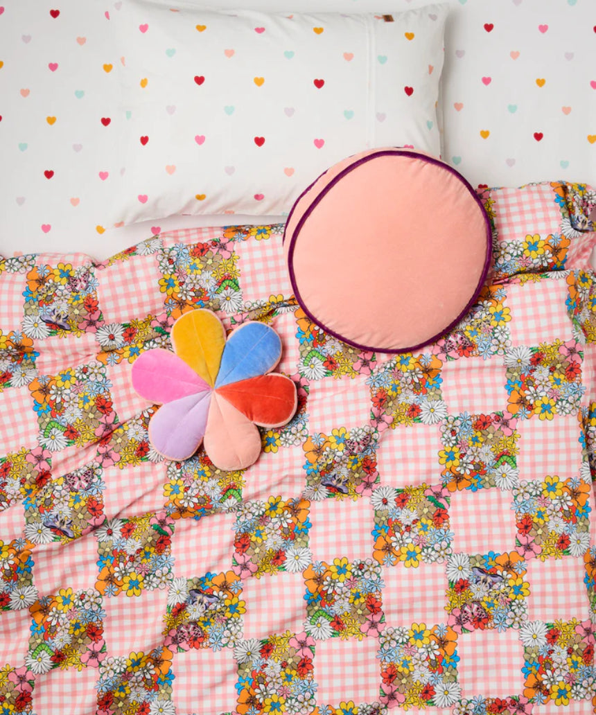 Kip & Co plum jam velvet pea cushion with soft fabric and plush texture, featuring a stylish floral pattern.