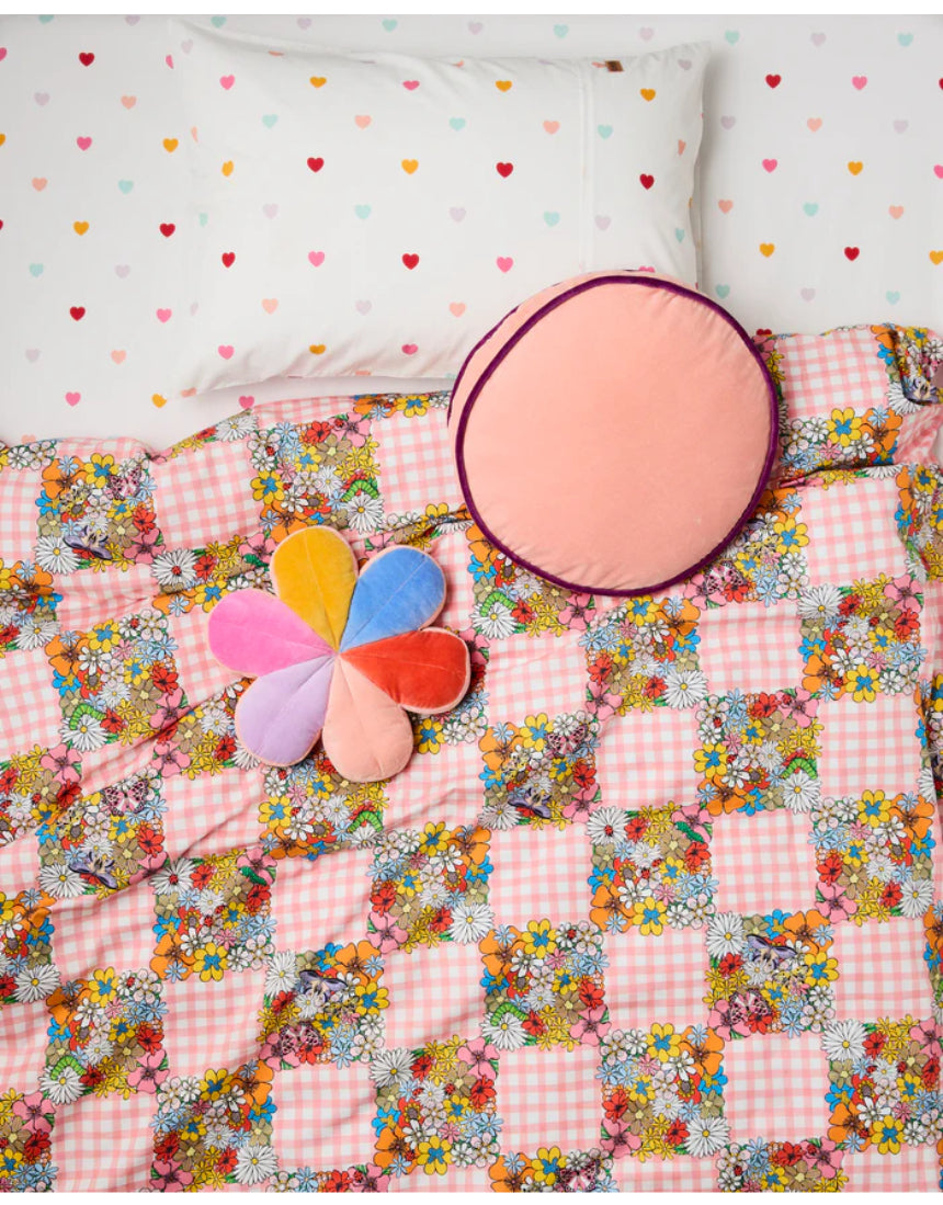 Kip & Co plum jam velvet pea cushion with soft fabric and plush texture, featuring a stylish floral pattern.