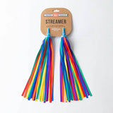 Colorful rainbow bike and scooter streamers by Beep attached to handlebars, fluttering with vibrant rainbow fabric.
