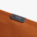 Bellroy 16-inch laptop sleeve in bronze, featuring a sleek protective case with smooth fabric exterior and subtle branding.
