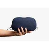 Bellroy navy toiletry kit with zippered compartments and durable nylon fabric, designed for organizing travel essentials.