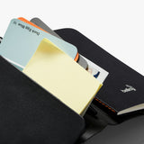 Bellroy black notebook cover showing sleek leather exterior with subtle stitching and compact design for easy carrying.