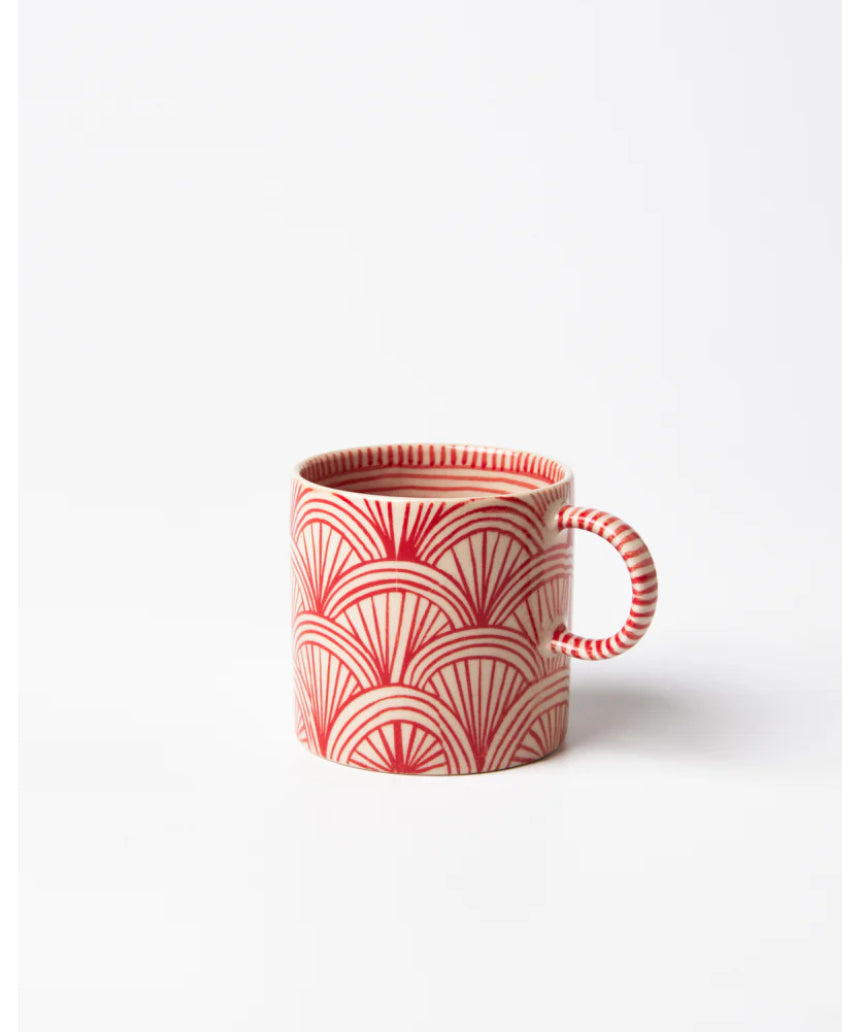 Jones & Co Caravan Espresso Ruby jewelry piece with intricate design and vibrant ruby accents on a neutral background.
