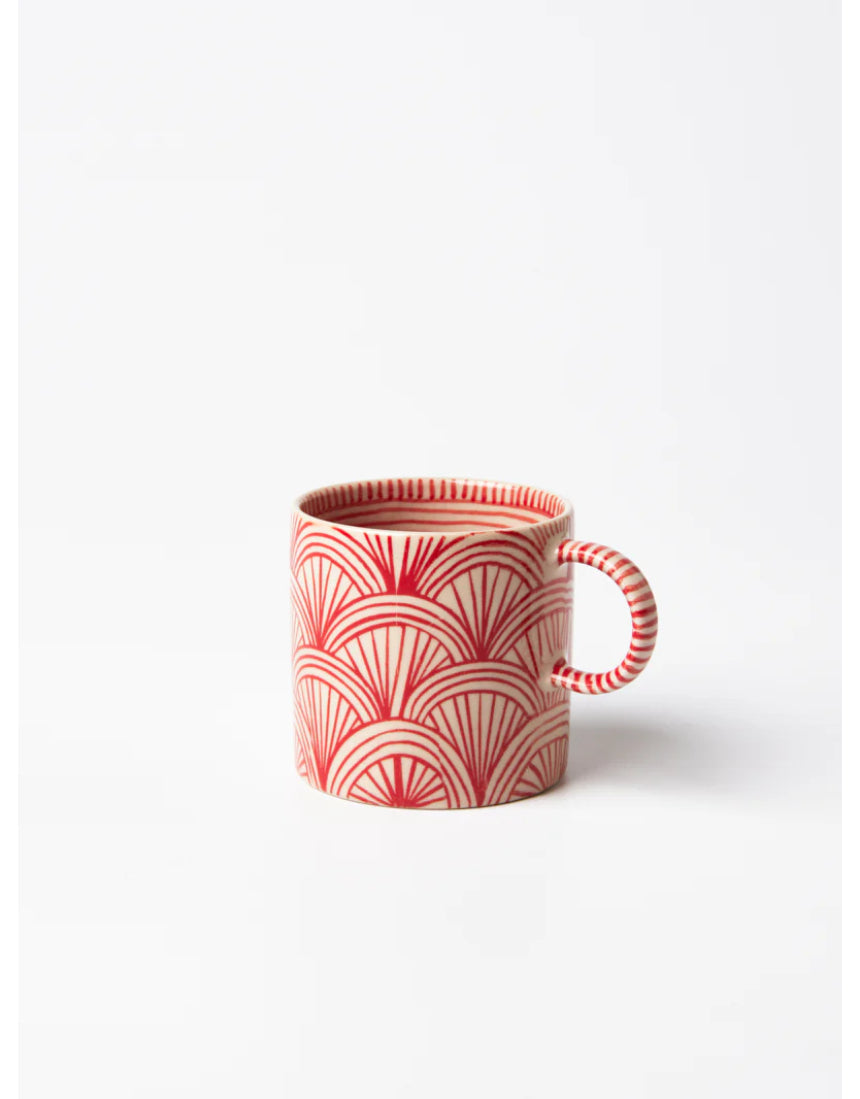 Jones & Co Caravan Espresso Ruby jewelry piece with intricate design and vibrant ruby accents on a neutral background.