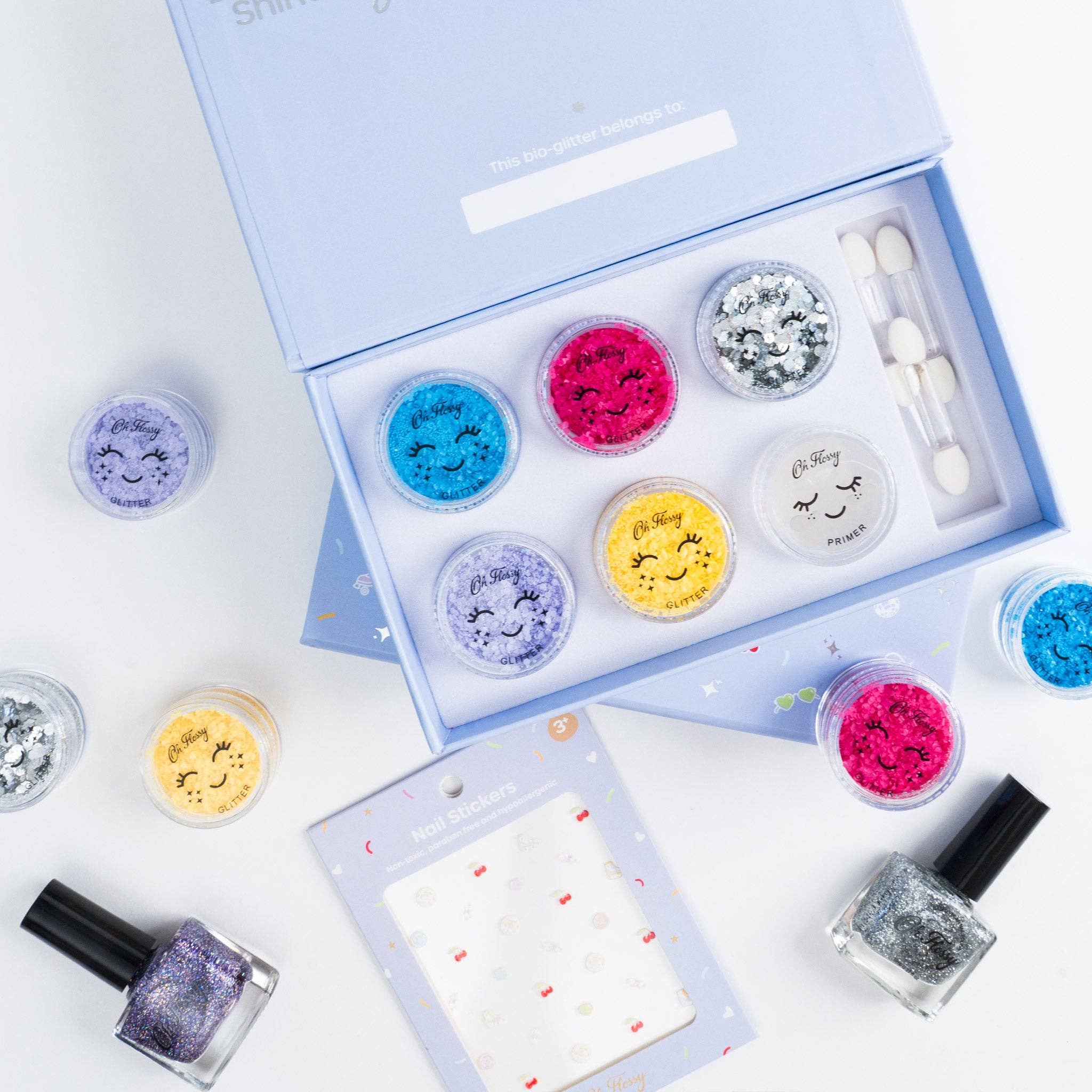 Kids disco fever glitter set by Oh Flossy featuring colorful glitter accessories and fun disco-themed items for children.
