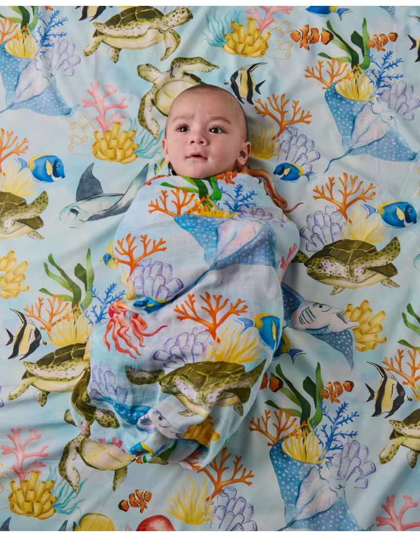 Kip & Co Reef Life bamboo swaddle with vibrant, tropical sea and coral print on soft fabric for baby comfort and style.