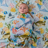 Kip & Co Reef Life bamboo swaddle with vibrant, tropical sea and coral print on soft fabric for baby comfort and style.