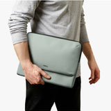 Bellroy Laptop Caddy 14-inch in Eucalyptus color, showing a sleek, organized carry case with multiple compartments for tech accessories.