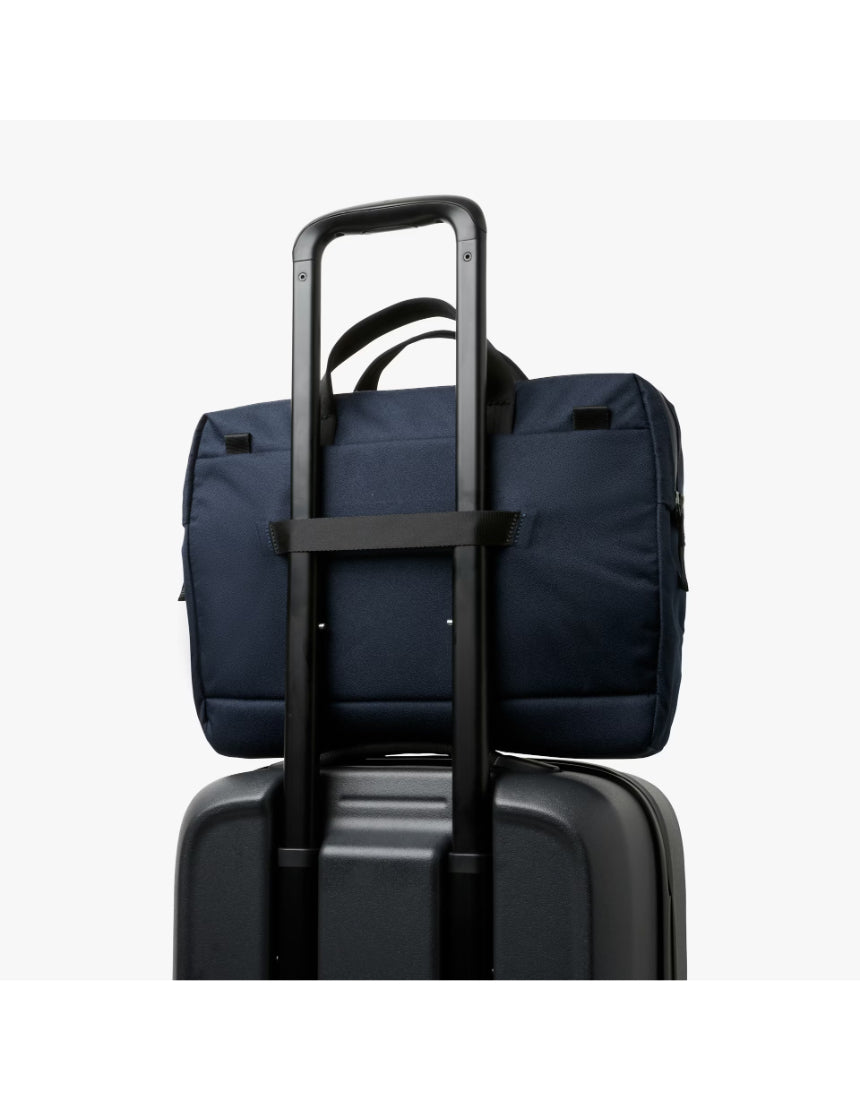 Bellroy Via Work Bag in navy fabric with leather accents, featuring multiple compartments and adjustable shoulder strap.