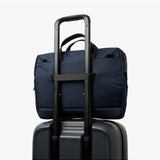 Bellroy Via Work Bag in navy fabric with leather accents, featuring multiple compartments and adjustable shoulder strap.