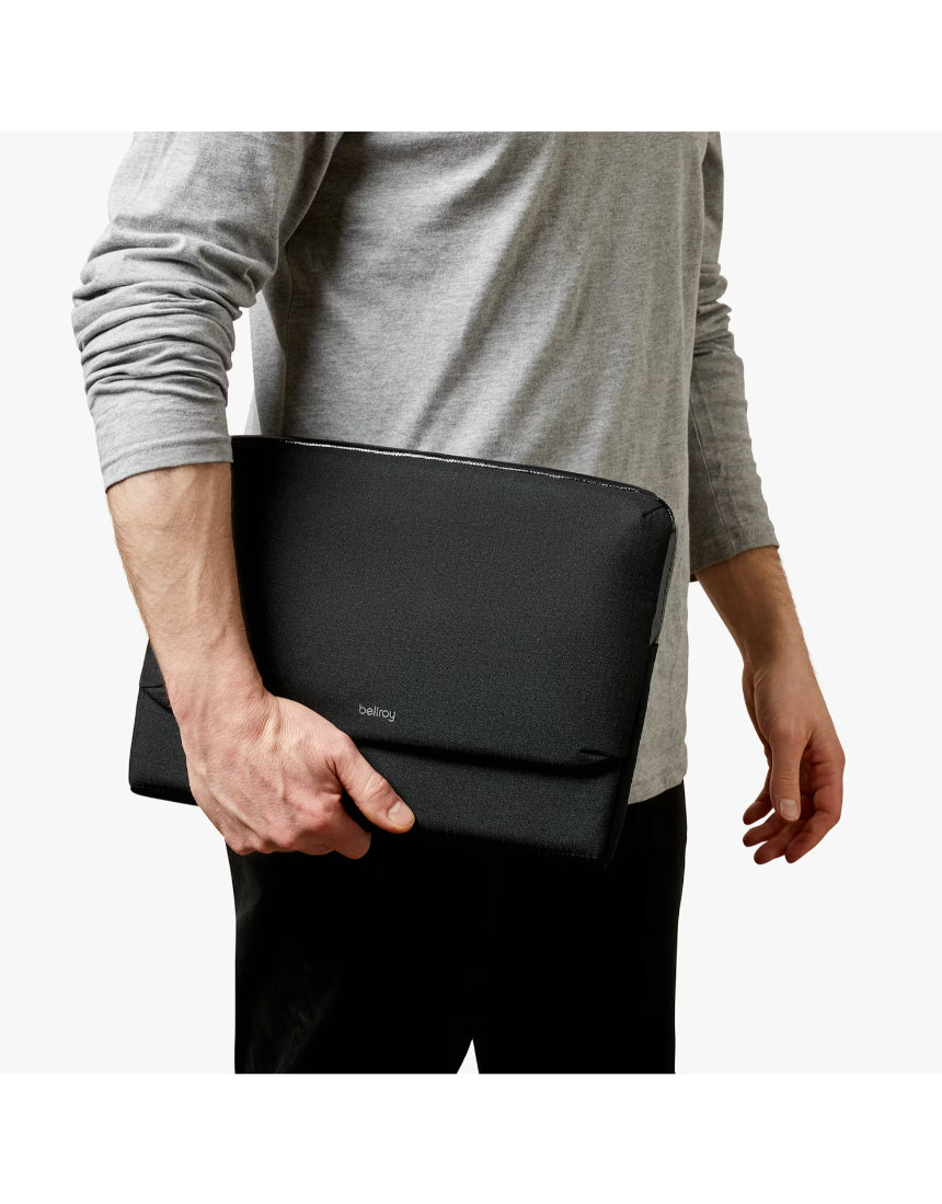 Black Bellroy 14-inch Laptop Caddy with multiple compartments for organizing accessories and laptop in a sleek, minimalist design.