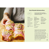Open baking book featuring pistachio recipes and tips, with colorful pages and pistachio nut illustrations, by Brumby Sunstate.