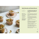 Open baking book featuring pistachio recipes from Brumby Sunstate, showing colorful pages with pistachio desserts and pastries.