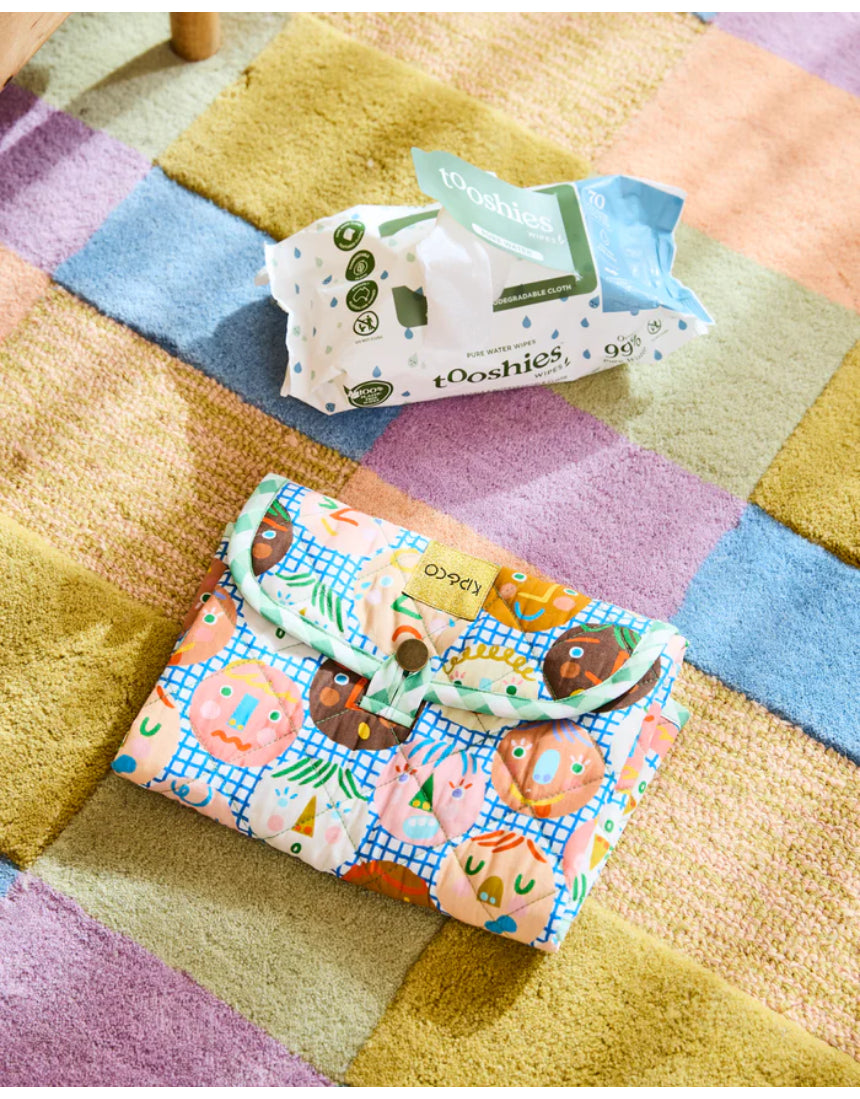 Kip & Co Cheer Up baby change mat with colorful, playful design on soft cushioned surface for comfortable diaper changes
