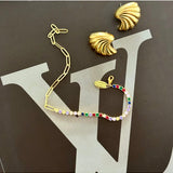 Salty Safari Oslo bracelet featuring a nautical-inspired design with beads and charms on a silver chain.