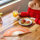 Fisura orange air conditioning fan with adjustable blades and compact design, ideal for cooling and air circulation.