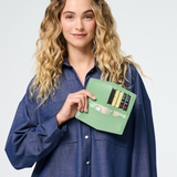 Fox & Leo The Swallet Sage wallet featuring a green leather exterior and compact design for everyday use.