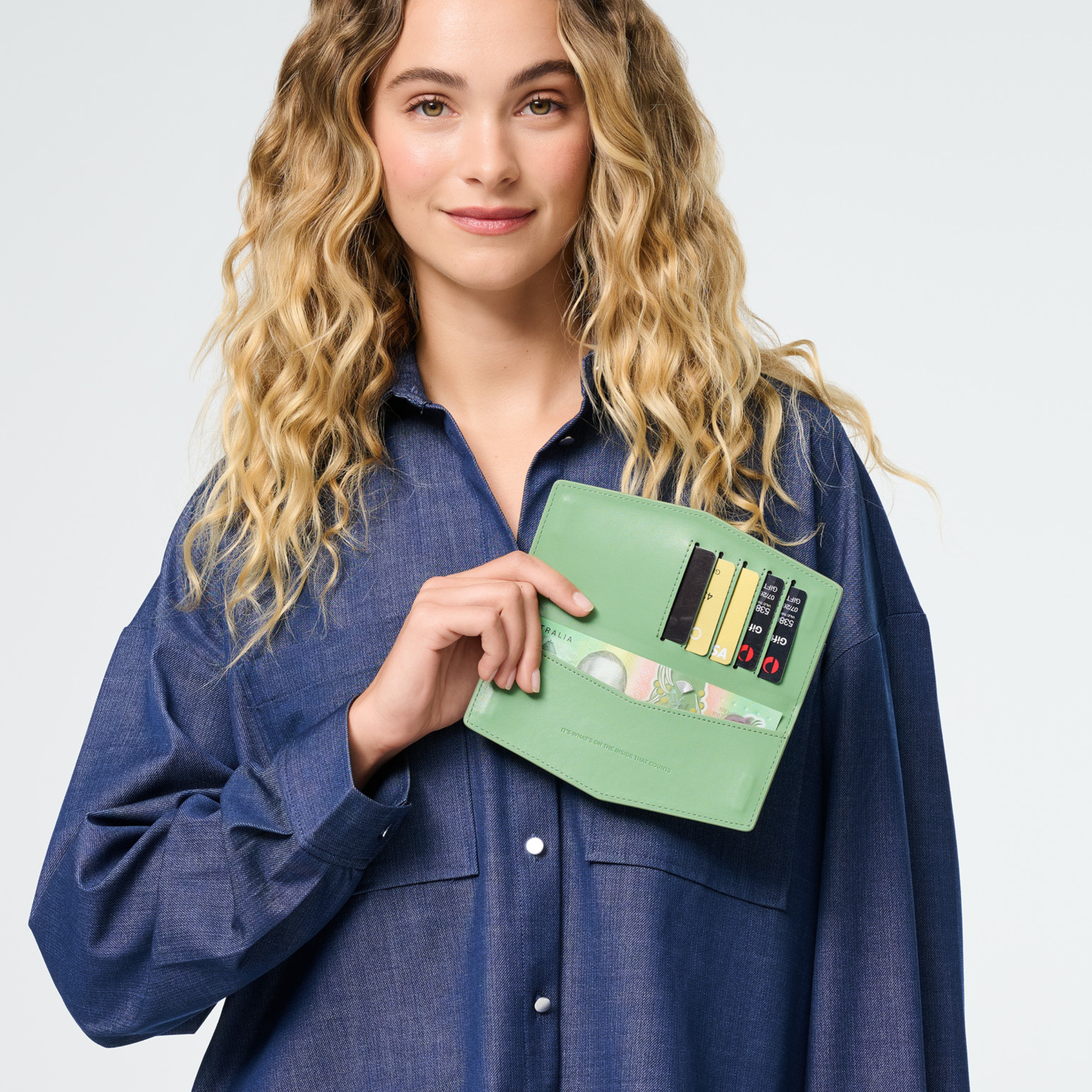 Fox & Leo The Swallet Sage wallet featuring a green leather exterior and compact design for everyday use.