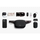 Bellroy Lite Belt Bag in black with adjustable strap and compact design, ideal for carrying essentials comfortably.