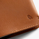 Bellroy caramel notebook cover showing smooth leather exterior and opening to reveal notebook inside.