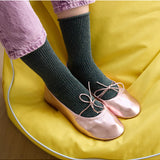 Green glitter lurex socks by Klue featuring shiny, textured fabric and a comfortable fit.