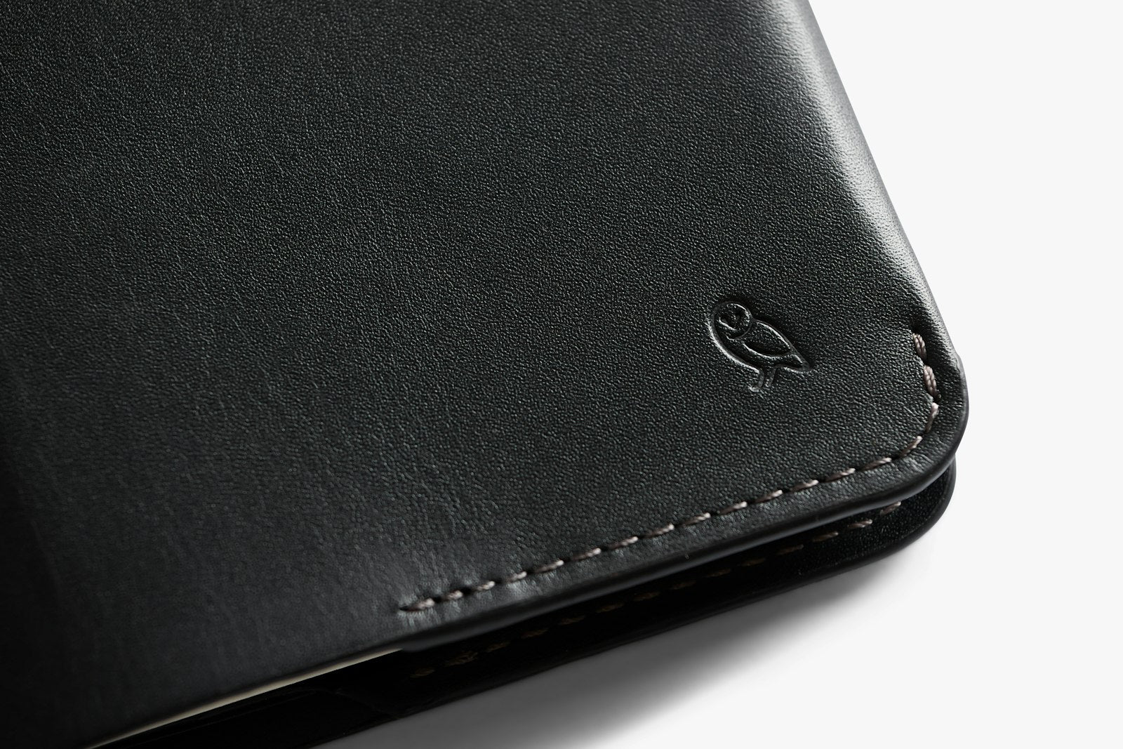 Bellroy black notebook cover showing sleek leather design with open cover and inside pockets for notes and accessories.