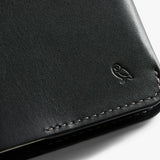 Bellroy black notebook cover showing sleek leather design with open cover and inside pockets for notes and accessories.