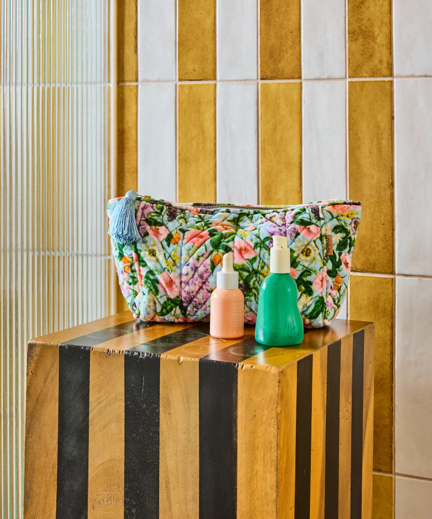 Kip & Co Spring In The Air velvet toiletry bag with floral pattern and pink zipper, accessory for travel and organization.