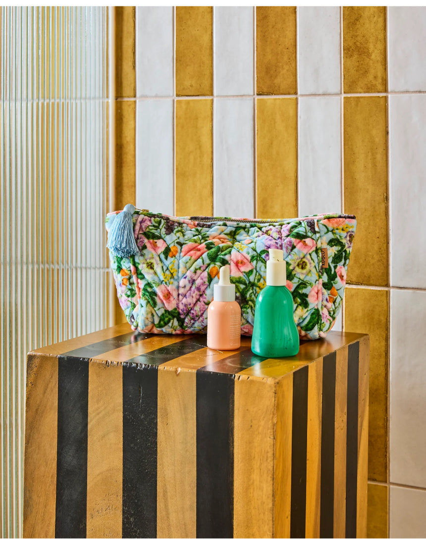Kip & Co Spring In The Air velvet toiletry bag with floral pattern and pink zipper, accessory for travel and organization.