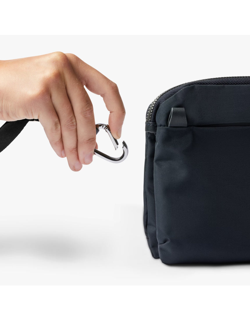 Bellroy Tokyo Side Bag in navy, a stylish crossbody bag with multiple compartments and adjustable strap, designed for everyday use.