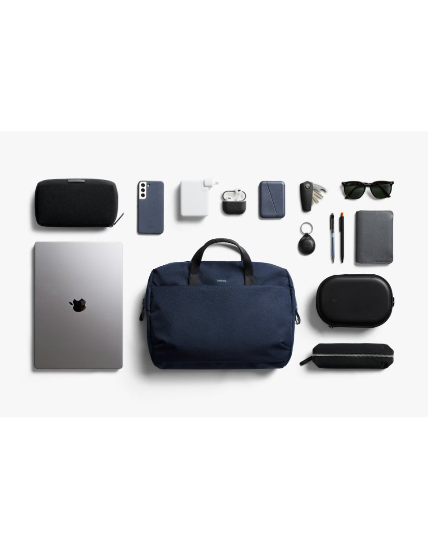 Bellroy Via Work Bag in navy, showing a sleek, durable leather bag with multiple compartments and adjustable shoulder strap.
