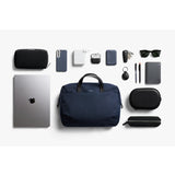 Bellroy Via Work Bag in navy, showing a sleek, durable leather bag with multiple compartments and adjustable shoulder strap.