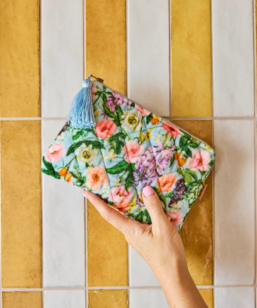 Kip & Co Spring In The Air velvet cosmetic purse featuring colorful floral pattern and zipper closure for toiletries and makeup.