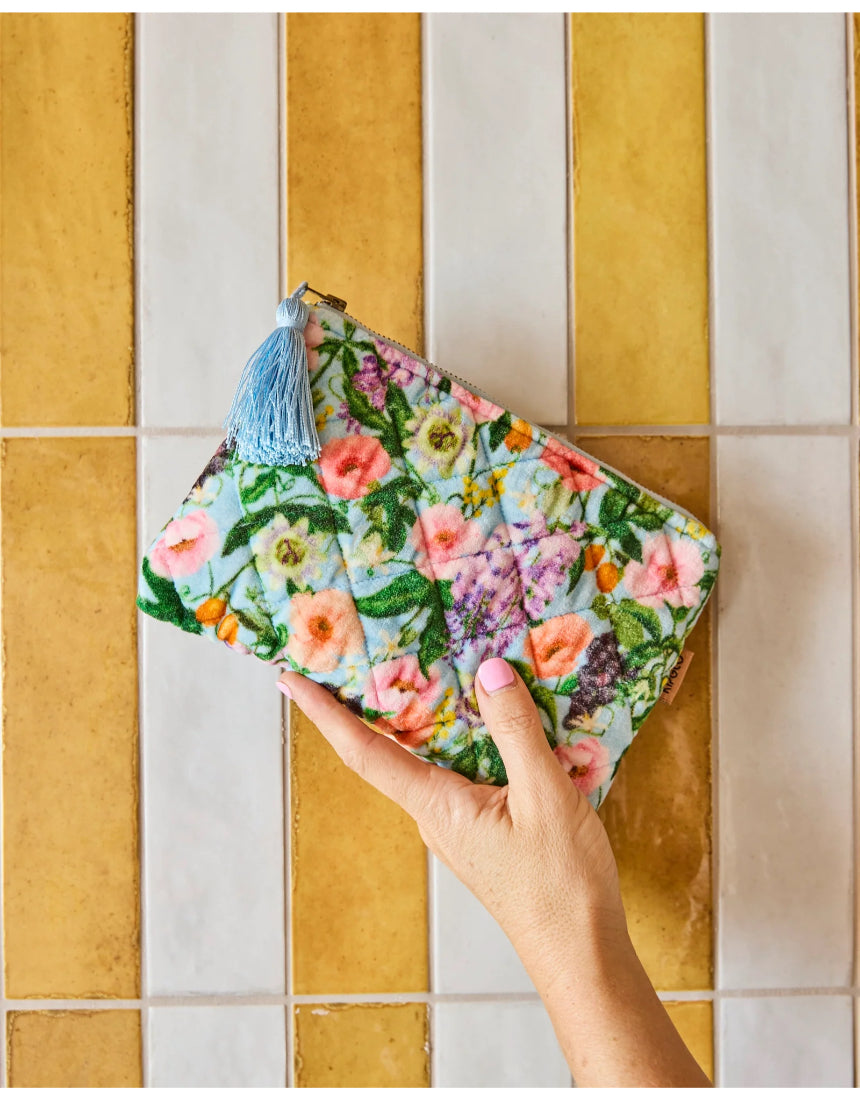 Kip & Co Spring In The Air velvet cosmetic purse featuring colorful floral pattern and zipper closure for toiletries and makeup.