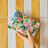 Kip & Co Spring In The Air velvet cosmetic purse featuring colorful floral pattern and zipper closure for toiletries and makeup.