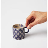 Jones & Co Caravan Espresso Indigo fabric swatch showcasing vibrant blue and beige woven textile pattern.