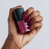 Hanami Cosmetics Doria nail polish bottle with pinkish-purple polish and sleek design, showcasing the Hanami nail polish product.