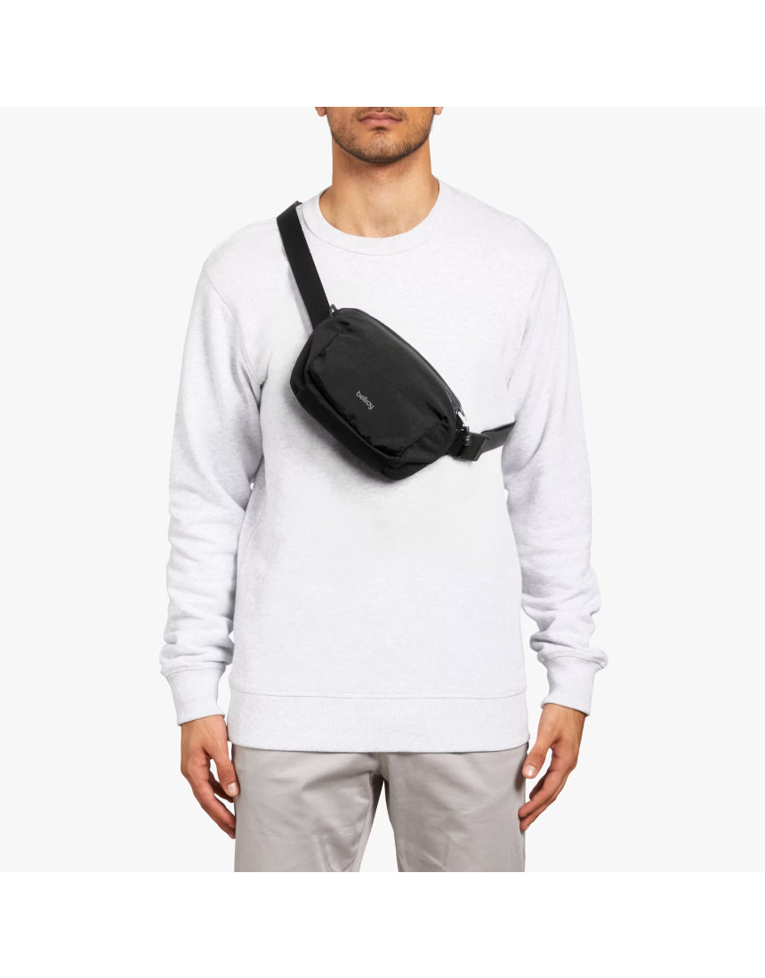 Bellroy Lite Belt Bag in black with adjustable strap and compact design, ideal for carrying essentials hands-free.