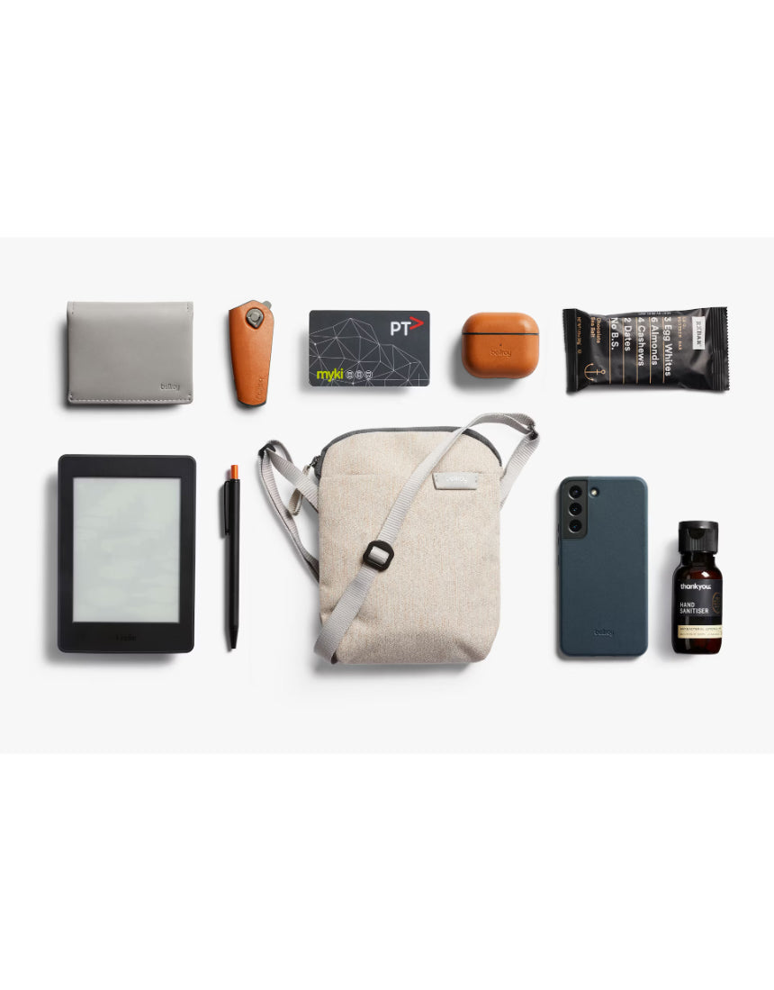 Bellroy City Pouch in Saltbush, a compact bag with multiple compartments for organization, made of durable material.