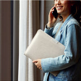 Bellroy 16-inch bronze laptop sleeve with smooth fabric and sleek design, featuring a minimalist style for tech protection.