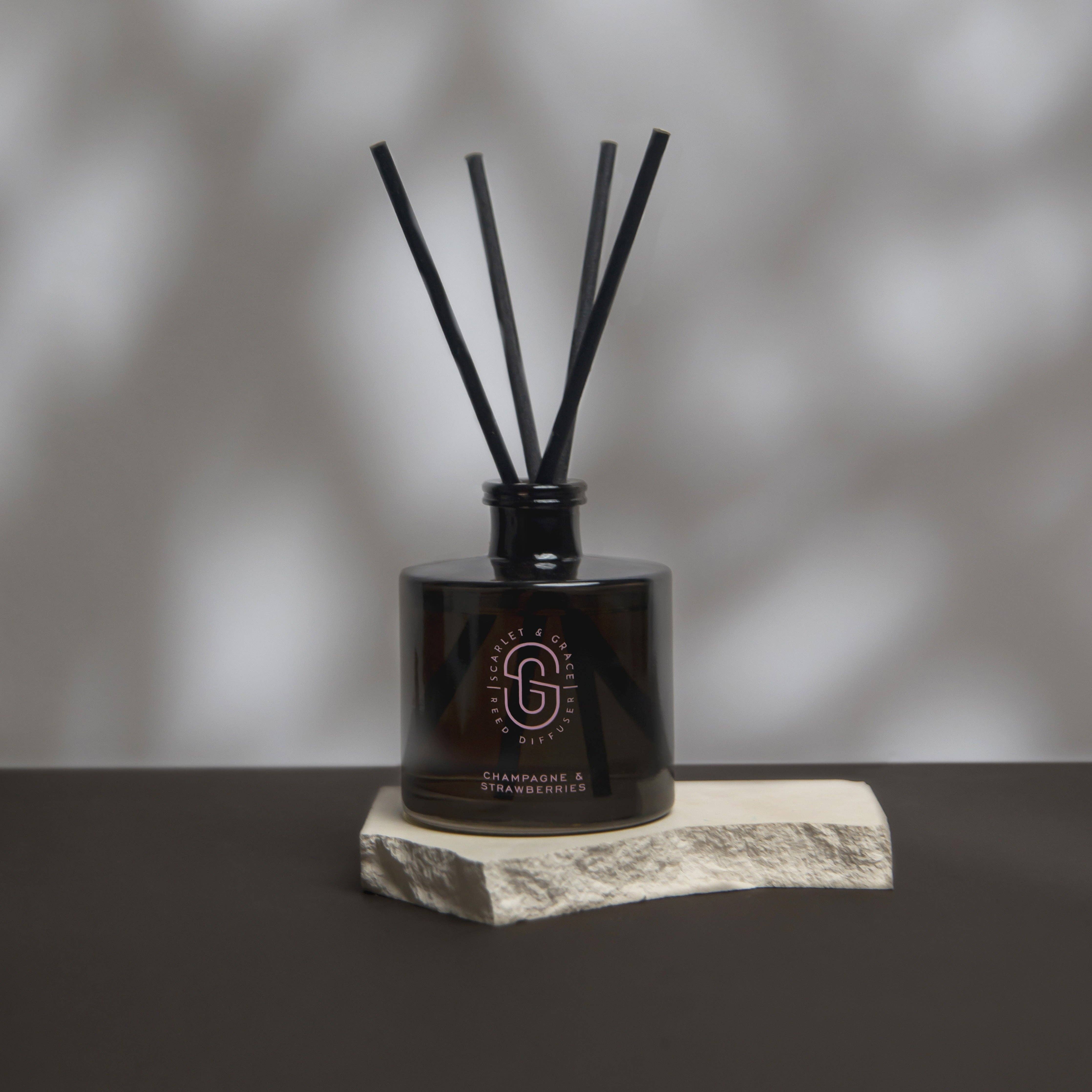 Scarlet & Grace 220ml diffuser with champagne and strawberries scent, featuring a clear glass bottle with a minimalist design.