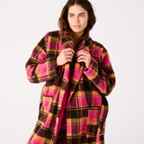 Kip & Co Alaskan adult Sherpa robe in cozy, plush fabric with a relaxed fit and hood, displayed on a hanger.