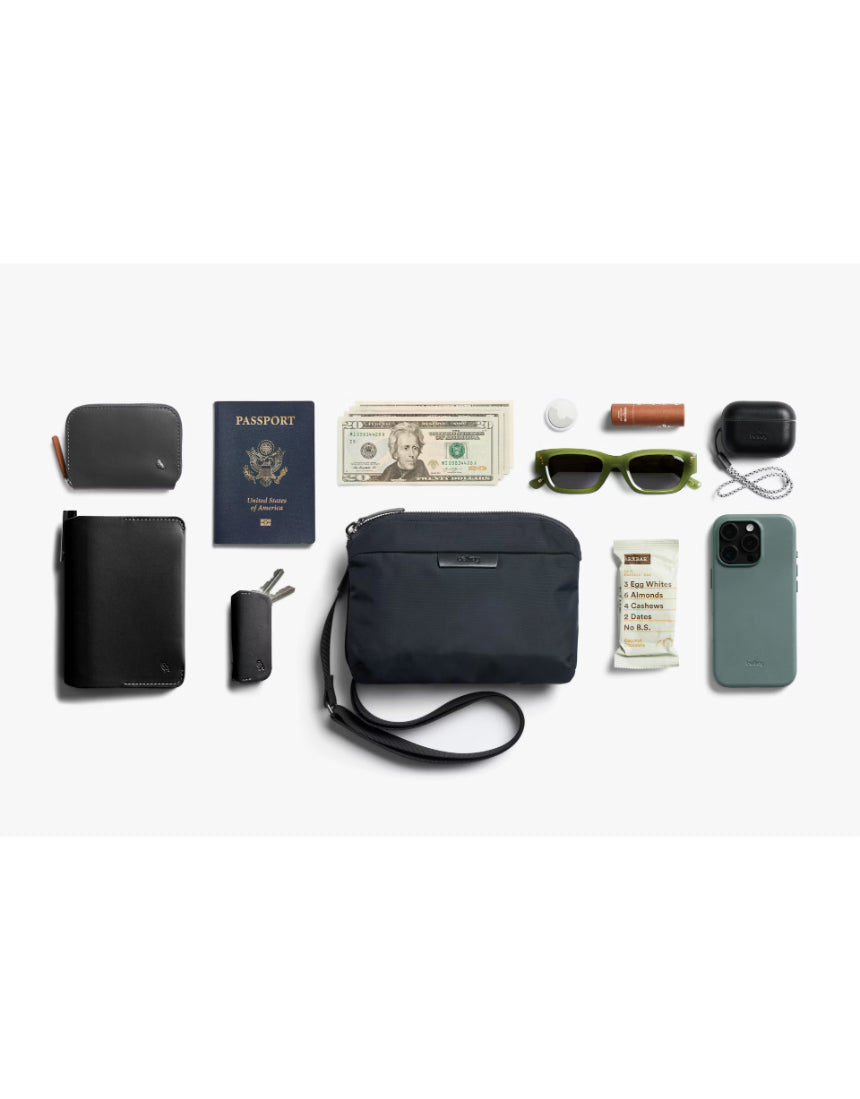 Bellroy Tokyo Side Bag in navy, a stylish crossbody bag with sleek design and adjustable strap, ideal for everyday use.